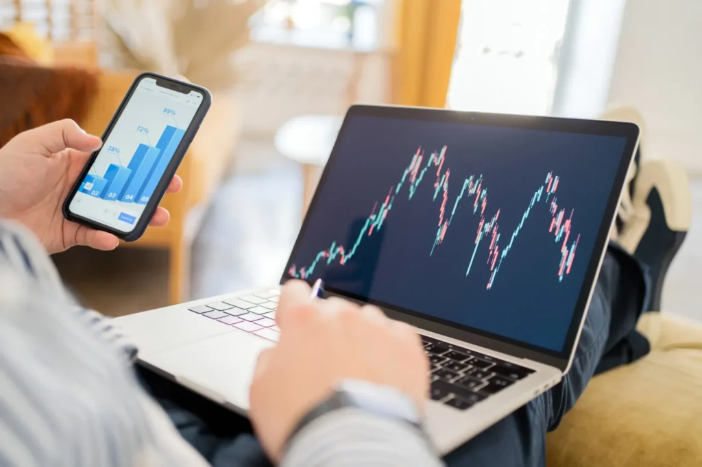 investor using aggr8finance financial updates on mobile and laptop