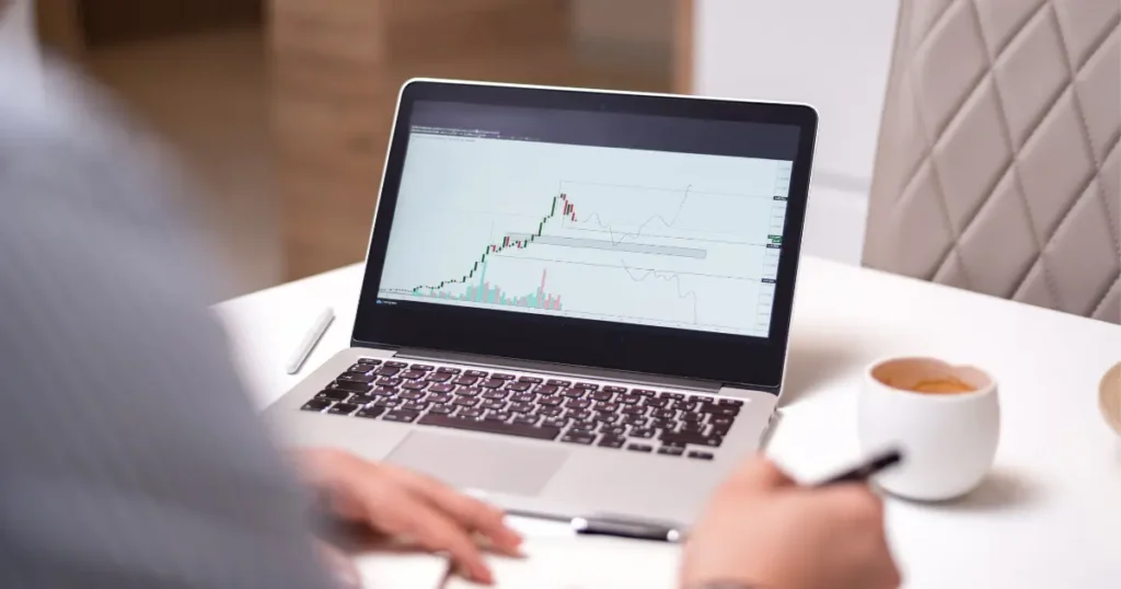 Beginner reviewing Invest1Now.com Stocks dashboard on laptop 2026
